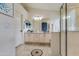 Bathroom featuring dual sink vanity and glass shower at 9001 W Lone Cactus Dr, Peoria, AZ 85382