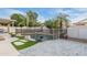 Backyard features pool with waterfall, patio, and lush landscaping at 9001 W Lone Cactus Dr, Peoria, AZ 85382