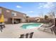 A beautiful backyard featuring a pristine pool, lounge chairs, and patio seating at 9144 W Quail Ave, Peoria, AZ 85382