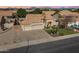 Stunning aerial view of a single-story home with a three-car garage and desert landscaping in a peaceful community at 9544 E Irwin Ave, Mesa, AZ 85209