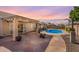 Beautiful backyard featuring a pool, fire pit, and paved patio, ideal for outdoor relaxation at 9544 E Irwin Ave, Mesa, AZ 85209