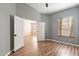 Bedroom featuring neutral walls, laminate floors, and a large window at 9544 E Irwin Ave, Mesa, AZ 85209