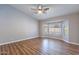 Bright bedroom with a ceiling fan and bay window showcasing pool views at 9544 E Irwin Ave, Mesa, AZ 85209