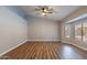 Bedroom with wood-look flooring, neutral walls and bright bay window at 9544 E Irwin Ave, Mesa, AZ 85209