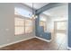 Bright dining room with modern chandelier and large windows providing great sunlight at 9544 E Irwin Ave, Mesa, AZ 85209