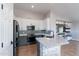 Well-equipped kitchen with stone-clad island, stylish backsplash and modern appliances at 9544 E Irwin Ave, Mesa, AZ 85209