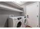 Convenient laundry room with washer, dryer and ample storage space at 9544 E Irwin Ave, Mesa, AZ 85209