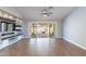 Empty living room, showcasing tile flooring, a ceiling fan, and direct access to the backyard at 9544 E Irwin Ave, Mesa, AZ 85209