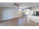 Open living room area with tile floors, ceiling fan and archway entrance at 9544 E Irwin Ave, Mesa, AZ 85209