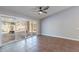 Empty living room, showcasing tile flooring, and direct access to the patio at 9544 E Irwin Ave, Mesa, AZ 85209