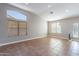 Light-filled living room with large windows and tile flooring at 9544 E Irwin Ave, Mesa, AZ 85209