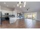 Open living area featuring a modern kitchen and sliding glass doors to the patio at 9544 E Irwin Ave, Mesa, AZ 85209