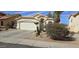 Charming single Gathering home features a two-car garage, desert landscaping, and a tile roof at 9614 W Mary Ann Dr, Peoria, AZ 85382