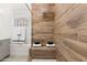 Luxurious tiled shower with built-in bench and modern fixtures in neutral tones at 1 Easy St # 15, Carefree, AZ 85377