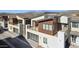 Modern townhome with multi-level balconies, sleek garage doors, and mountain views at 1 Easy St # 5, Carefree, AZ 85377