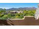 Scenic view of desert landscape, mountains and sprawling community from upper level patio at 10112 E Old Trail Rd, Scottsdale, AZ 85262