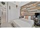 Nicely decorated bedroom features a wood panel accent wall and comfortable bed at 9388 W Cashman Dr, Peoria, AZ 85383