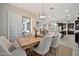 Bright dining area with modern lighting, and a sliding glass door with shutters at 9388 W Cashman Dr, Peoria, AZ 85383
