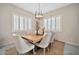 Bright dining area with modern lighting, and large windows with shutters at 9388 W Cashman Dr, Peoria, AZ 85383