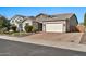 Charming single-story home features stone accents, a two-car garage, and well-maintained landscaping at 9388 W Cashman Dr, Peoria, AZ 85383