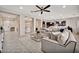 Open-concept living area with comfortable seating, stylish decor, and seamless flow to other rooms at 9388 W Cashman Dr, Peoria, AZ 85383