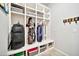 Organized mudroom with built-in storage, cubbies, and hooks for efficient storage of golf bags and accessories at 9388 W Cashman Dr, Peoria, AZ 85383