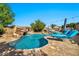 Beautiful pool with rock waterfall and slide, tanning ledge, and poolside lounge chairs for relaxing at 9388 W Cashman Dr, Peoria, AZ 85383