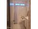 Clean, white bathroom with tub and shower combo and a white vanity at 10622 W Mohawk Ln, Peoria, AZ 85382