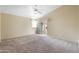 Empty bedroom with carpet and a sliding door to the patio area at 10622 W Mohawk Ln, Peoria, AZ 85382