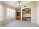 Bedroom with built-in shelves and desk area and wood look tile flooring at 10622 W Mohawk Ln, Peoria, AZ 85382