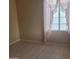 Bedroom with wood-look floors and pink sheer curtains at 10622 W Mohawk Ln, Peoria, AZ 85382