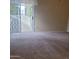 Bedroom with sliding glass door leading to an outdoor patio at 10622 W Mohawk Ln, Peoria, AZ 85382