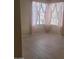 Bright bedroom with wood-look flooring, neutral walls, and natural light from the large window at 10622 W Mohawk Ln, Peoria, AZ 85382