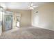 Neutral bedroom boasting sliding door access to outdoor living at 10622 W Mohawk Ln, Peoria, AZ 85382