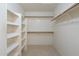 Walk-in closet featuring shelving, rod hanging space, and ample storage for organization at 10622 W Mohawk Ln, Peoria, AZ 85382