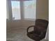Cozy dining area featuring tile flooring, a corner window, and a comfortable office chair at 10622 W Mohawk Ln, Peoria, AZ 85382