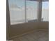 Bright dining area with tile flooring and large windows that let in plenty of natural light at 10622 W Mohawk Ln, Peoria, AZ 85382