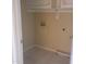 Compact laundry room with tile flooring, neutral walls, and essential hookups for appliances at 10622 W Mohawk Ln, Peoria, AZ 85382