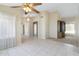 Spacious living room features tile flooring and a ceiling fan for added comfort at 10622 W Mohawk Ln, Peoria, AZ 85382