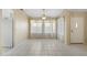 Spacious living area with tile floors and plenty of natural light at 10622 W Mohawk Ln, Peoria, AZ 85382