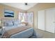 Cozy main bedroom showcasing a bed, soft rug, and ocean art above the headboard at 10622 W Mohawk Ln, Peoria, AZ 85382