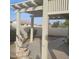 Covered patio area with stone water feature and block fence at 10622 W Mohawk Ln, Peoria, AZ 85382