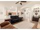 Inviting living area with wood floors and an open concept layout to the kitchen and dining area at 1182 E Jasper Dr, Gilbert, AZ 85296