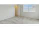 Cozy bedroom with plush carpeting, window with blinds, and ample natural light at 12054 W Aster W Dr, El Mirage, AZ 85335