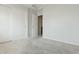 Spacious carpeted bedroom with dual closets and natural lighting at 12054 W Aster W Dr, El Mirage, AZ 85335