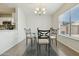 Comfortable dining space that is brightly lit and offers tile flooring at 12054 W Aster W Dr, El Mirage, AZ 85335