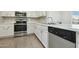 Modern kitchen featuring stainless steel appliances and white countertops at 12054 W Aster W Dr, El Mirage, AZ 85335