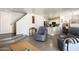 Cozy living room with a view into the kitchen, providing an open and welcoming living space at 12054 W Aster W Dr, El Mirage, AZ 85335