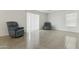 Inviting living room area featuring large windows and comfortable seating at 12054 W Aster W Dr, El Mirage, AZ 85335