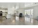 Bright living area featuring tile flooring, modern paint, and access to the backyard patio at 12054 W Aster W Dr, El Mirage, AZ 85335